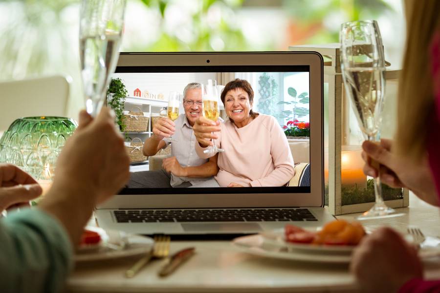 seniors video chatting friends for a happy hour