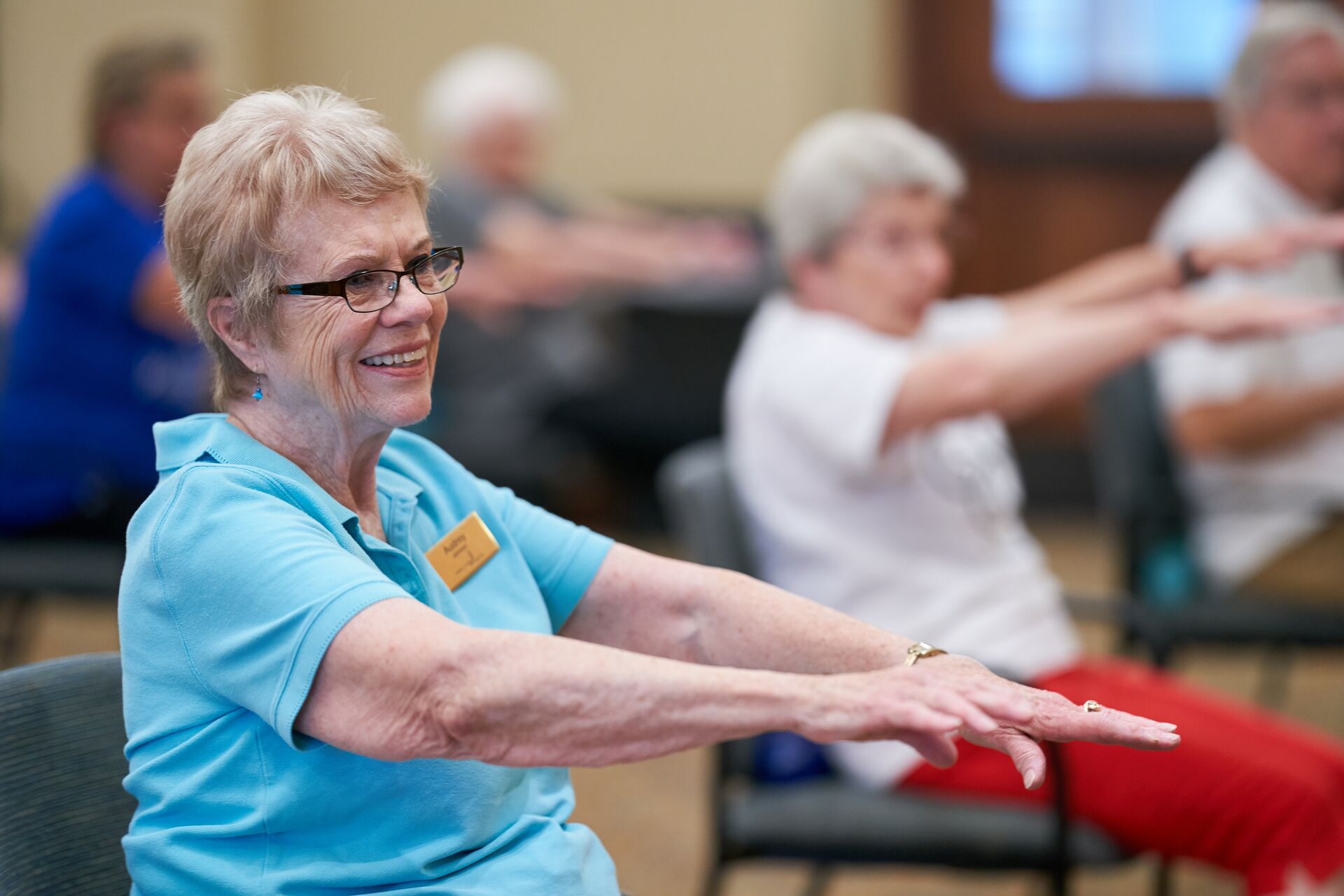Senior residents practice chair exercises.