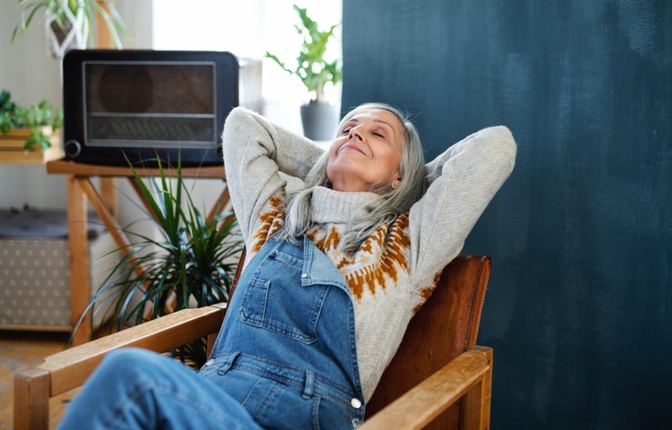 Senior woman relaxing in a chair at home.