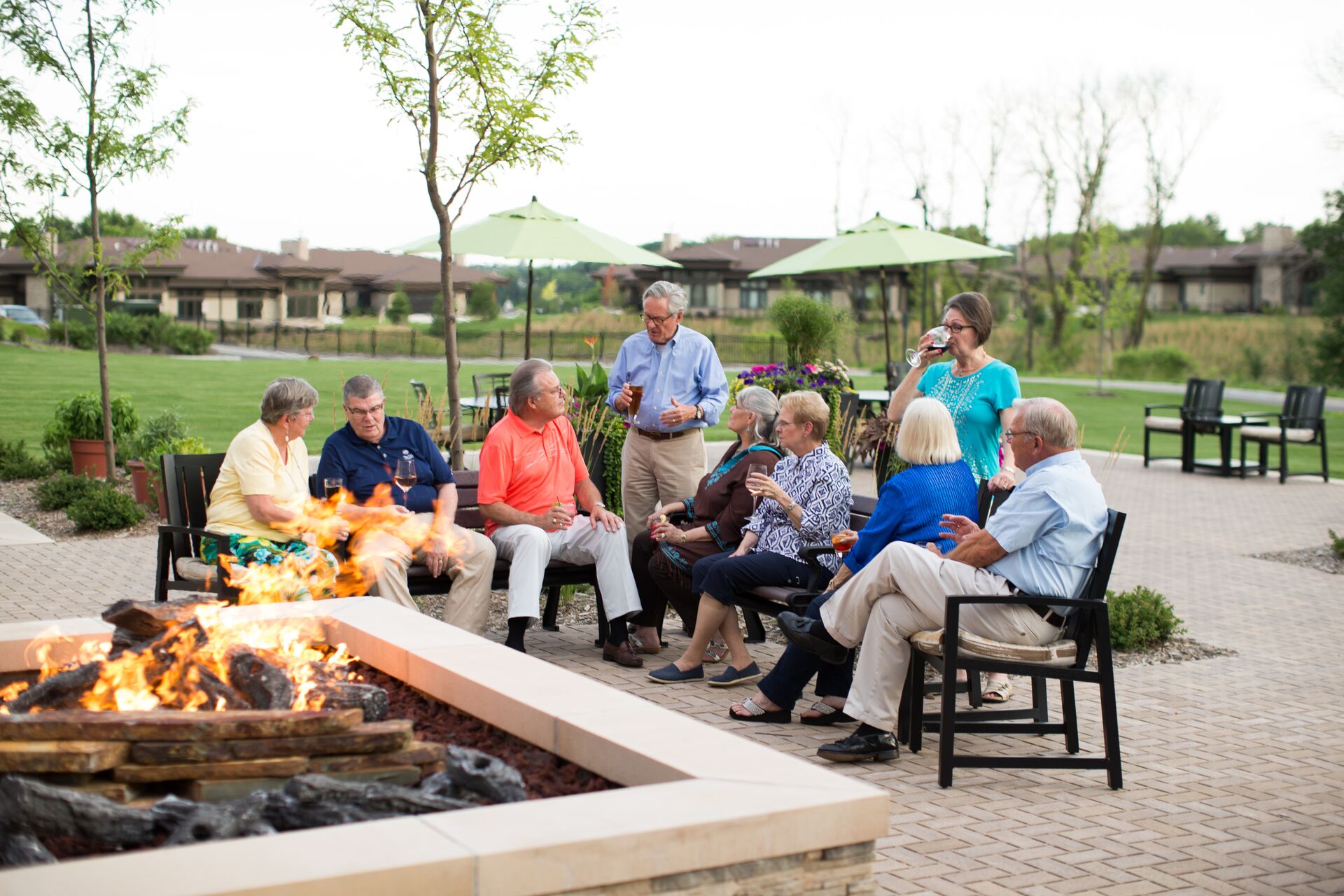 Senior living residents relaxing outside