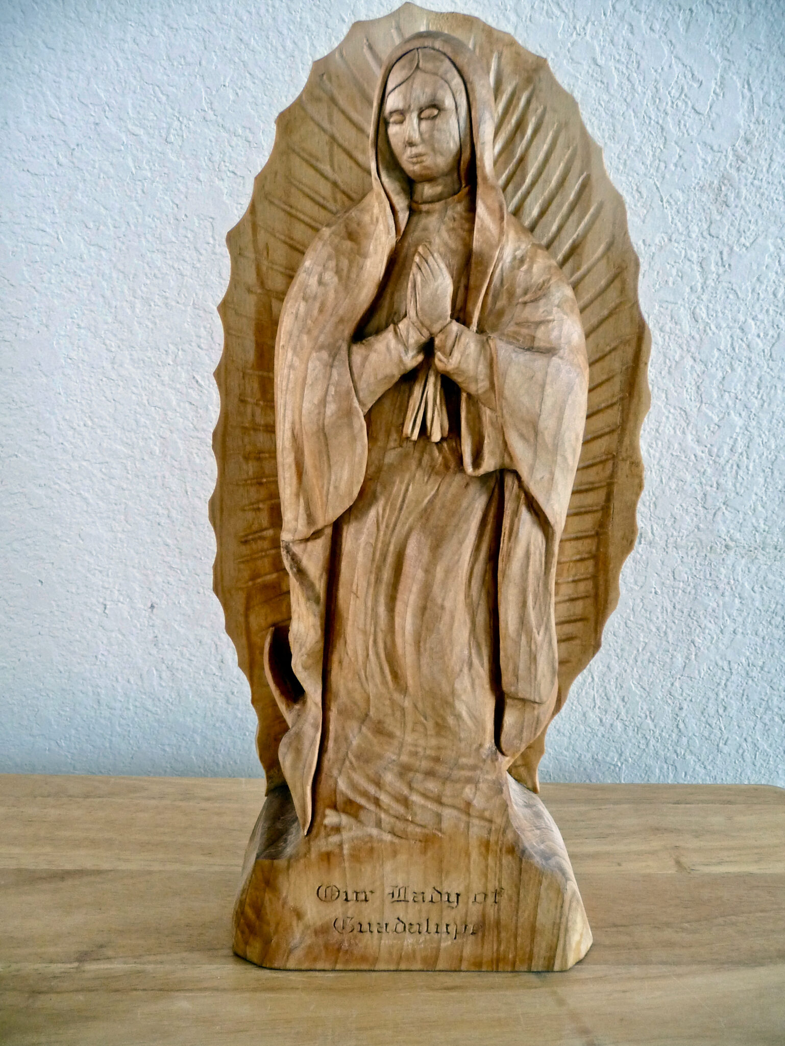 Trillium Woods Resident Felix Tristani's “Lady of Guadalupe” wood sculpture