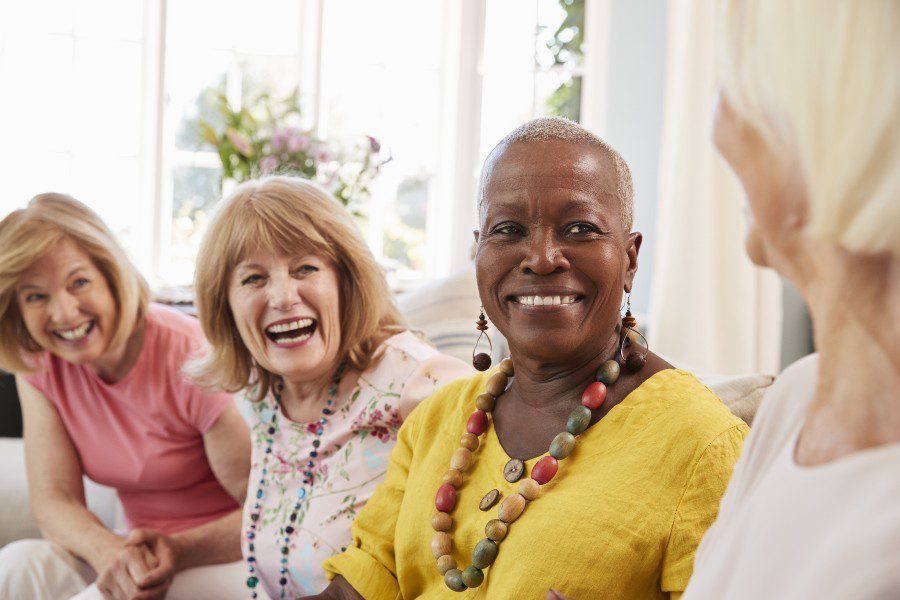 four senior ladies socializing