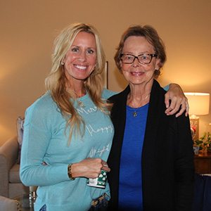 senior smiling with a caregiver